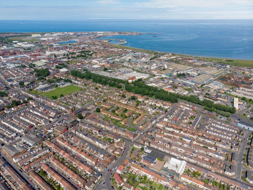 aerial view of Hartlepool, featuring rows of houses and the coastline